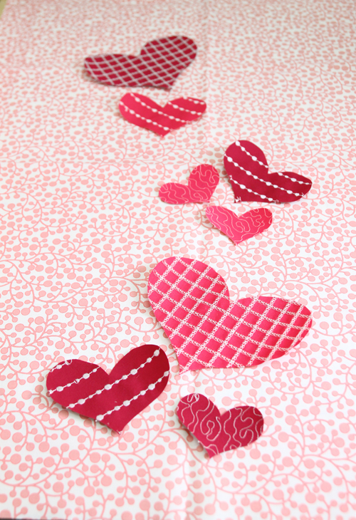 arrange hearts on fabric