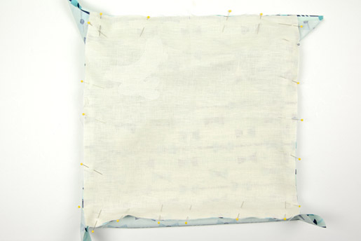 Fold and press the 16" x 16" piece of fabric