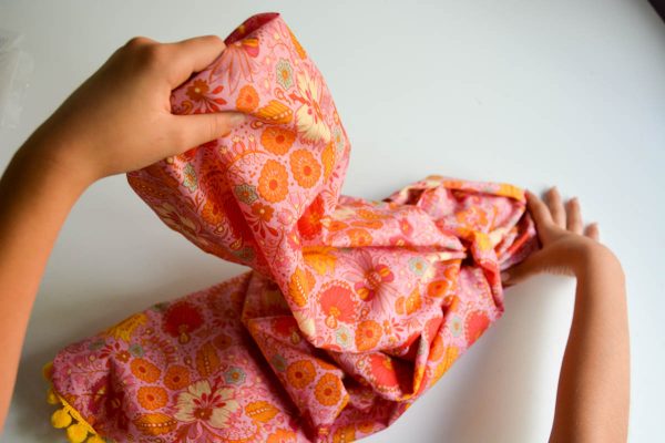 PomPom Scarf Sewing Tutorial-turning scarf inside out 4