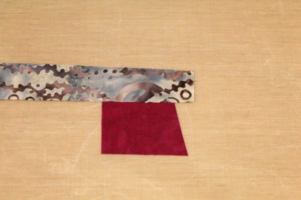 Fused Log Cabin Table Runner Tutorial - placing strip along the top edge