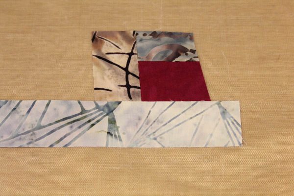 Fused Log Cabin Table Runner Tutorial - Place strip along the bottom edge