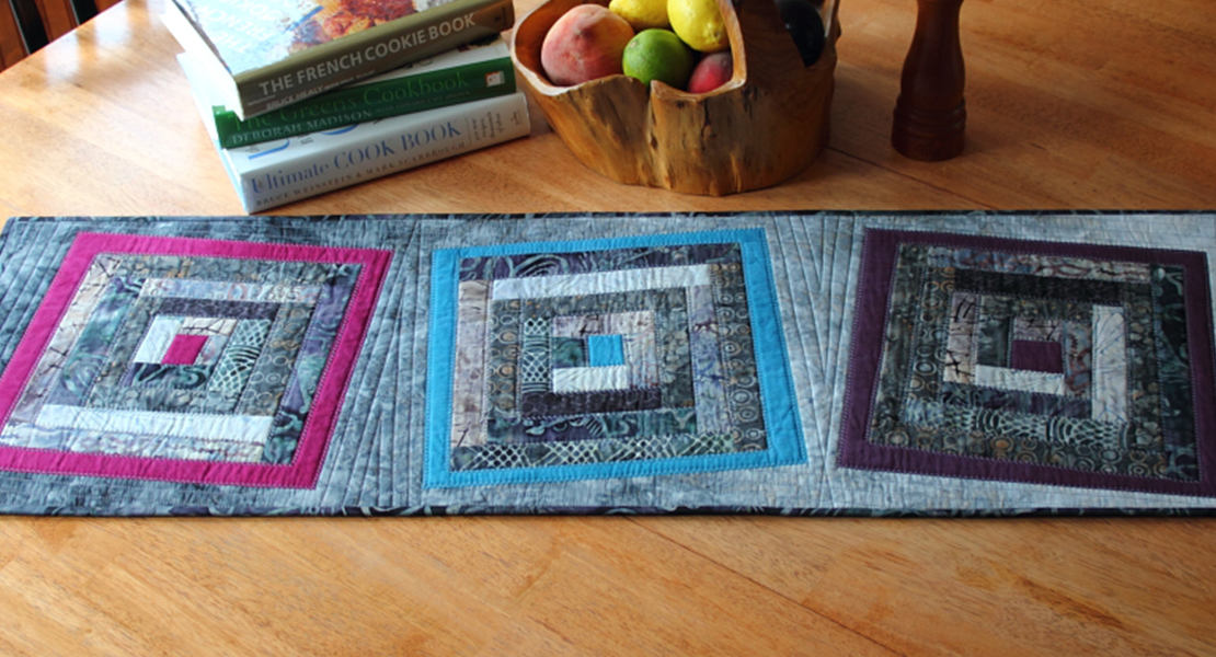 Fused log cabin table runner
