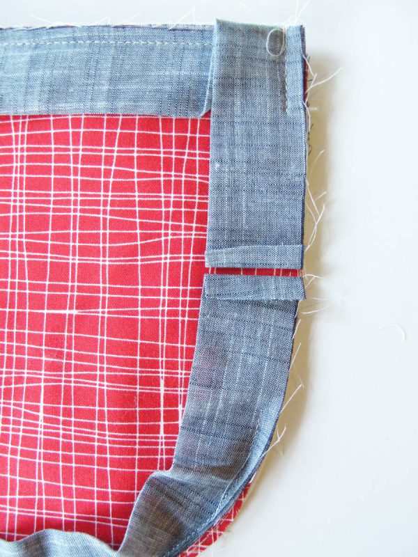 Vinyl Zip Pouch Tutorial - Fold and press the binding edges back
