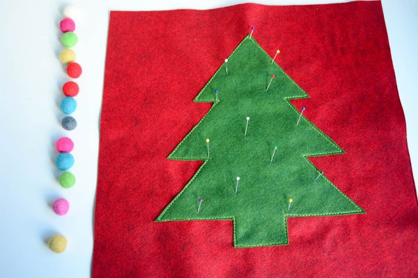 Christmas Tree Pillow Tutorial - place the pom poms in a line i