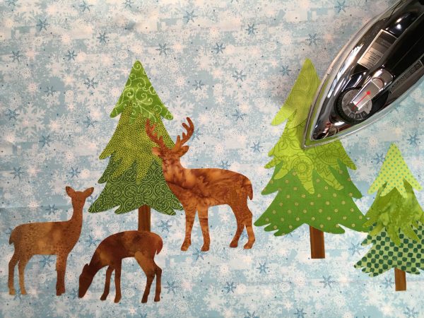 Mantel Cover Tutorial - add the trees and deer to each end of your background fabric