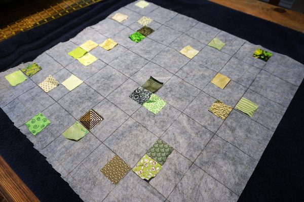 Postage stamp patchwork pillow
