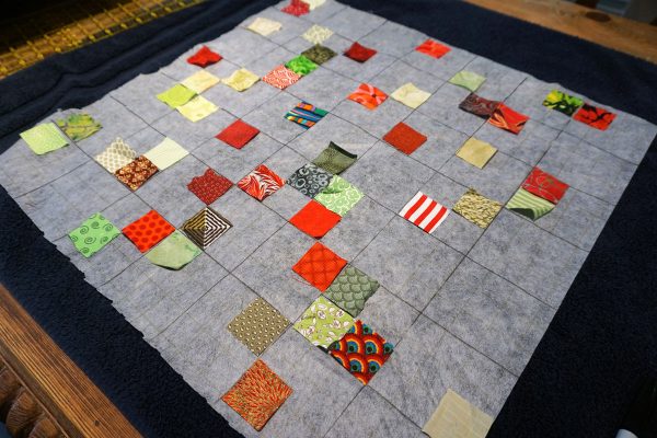 Postage stamp patchwork pillow