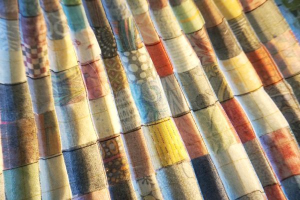 Postage stamp patchwork pillow