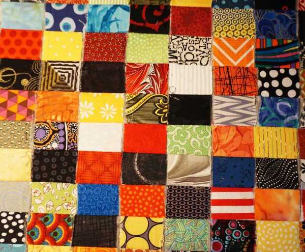 Postage stamp patchwork pillow