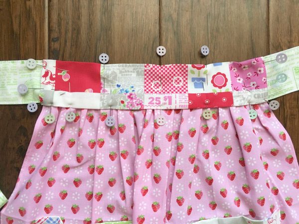Farm Fresh Apron Tutorial: Pinning waistband closed.