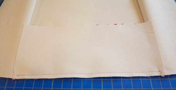 Oilcloth-lined Garden Tote Tutoriall - Open out the side pieces and sew on the bottom piece