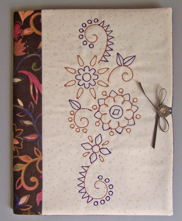 Embroidered Journal Cover-tie the ribbon around the button to hold the journal closed