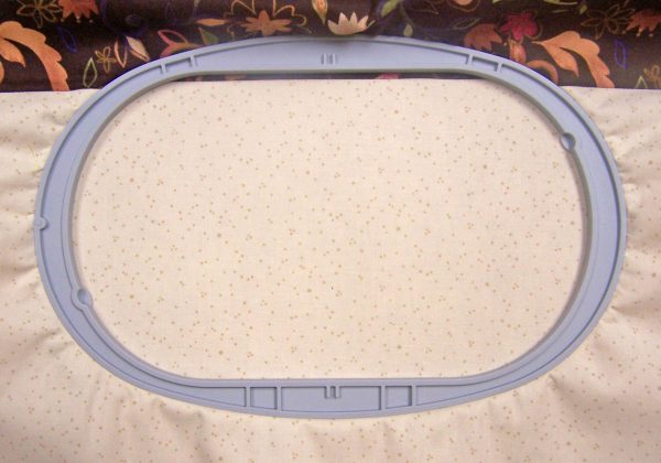 Embroidered Journal Cover_Placing the outer cover in an oval hoop