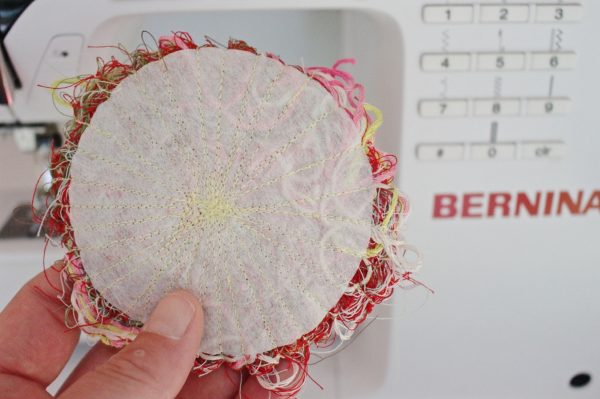 Recycled thread flower pin Step Seven: sew the flower