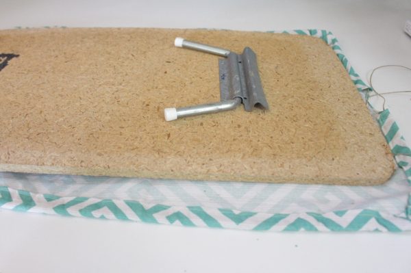 Mini ironing board cover Step Nine: secure cover to board