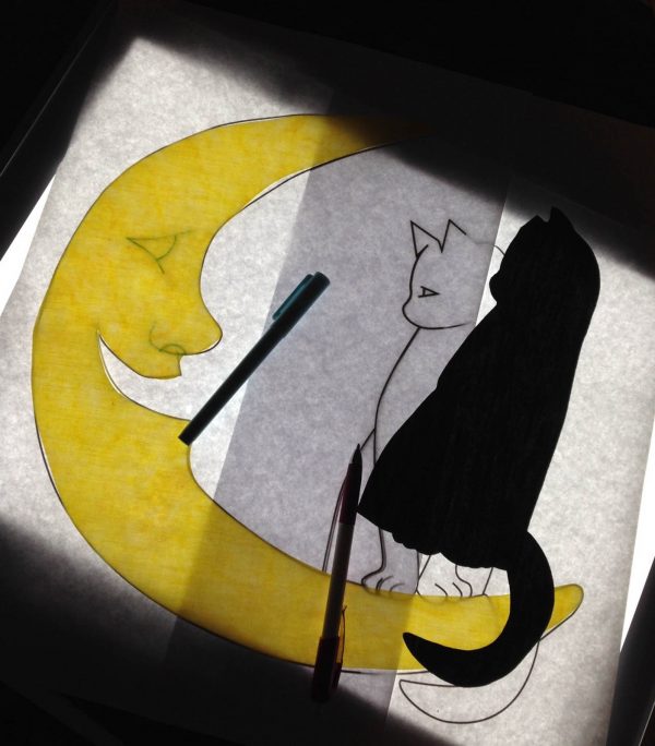 Moon Wall Hanging-Trace the features using a chalk pencil on the black fabric and blue water-soluble pen on the yellow moon