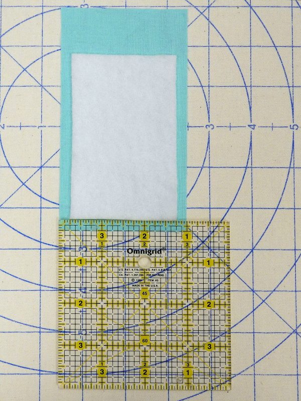 ironing on batting 1200 x 1600 BERNINA WeAllSew Blog fabric gift tag