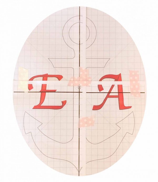 Piece the sheets together with tape, matching up the alignment marks. Trim off the excess paper around the design. Set aside.