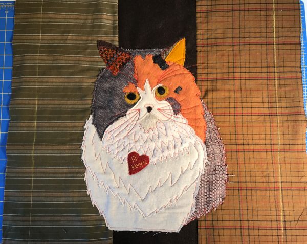Pet Applique Pillow-trim the fabric pieces with the cat