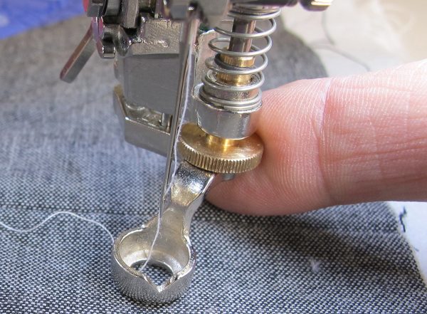 place your quilt sandwich under the foot and lower the foot