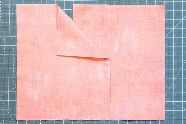 fold the pillow backing rectangles in half and overlap