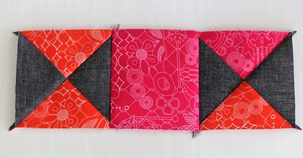 Piecing, Seam an orange and gray square unit to a pink square; then seam the pink square to an orange, pink and gray square unit.
