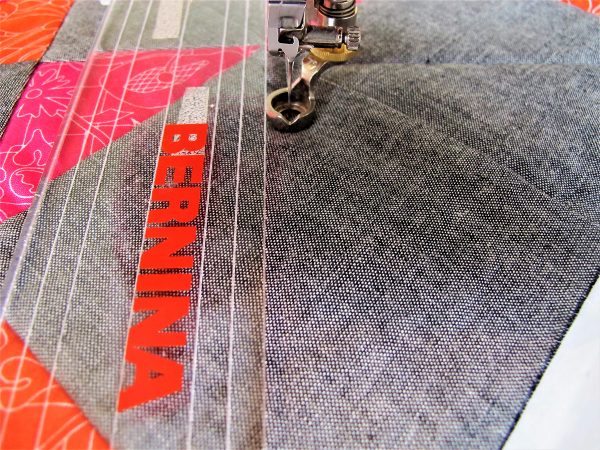 Using the ruler as a guide, stitch a diagonal straight line from corner to corner