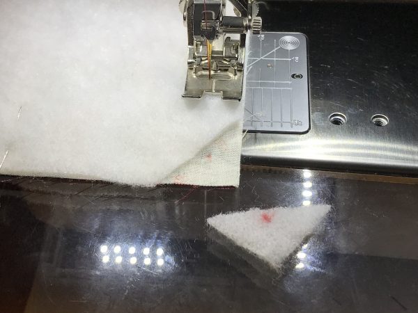 trim off a triangle of the batting