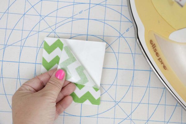 Shamrock Door Hanger In the Hoop step two: remove fusible web paper