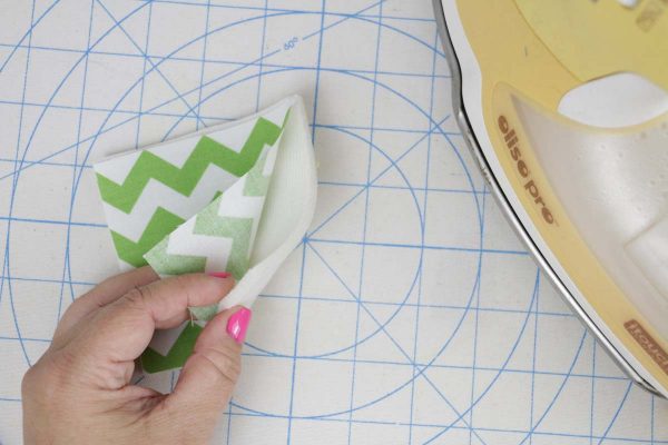 Shamrock Door Hanger In the Hoop step two: press wrong side of applique to foam