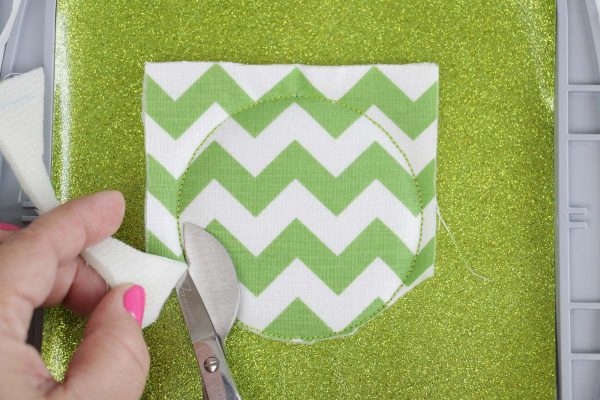 Shamrock door hanger in the hoop Step 5, use duckbill applique scissors and cut close to the stitching