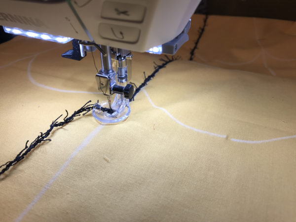 Spider Web Door Banner tutorial WeAllSew Blog - attaching the spider web with the BERNINA couching foot #43