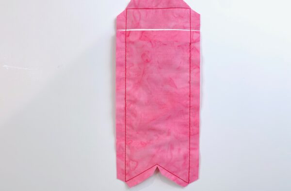 trim to a ½” seam allowance and clip off the corners