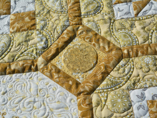 The cornerstone embroideries on the BERNINA 125th Anniversary Quil