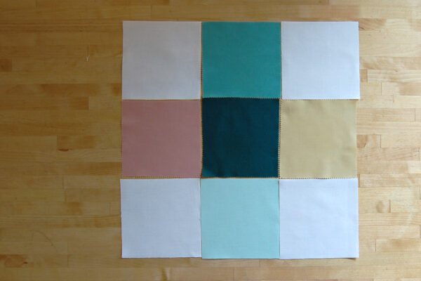 Minki Backed Patchwork Baby Quilt tutorial at WeAllSew