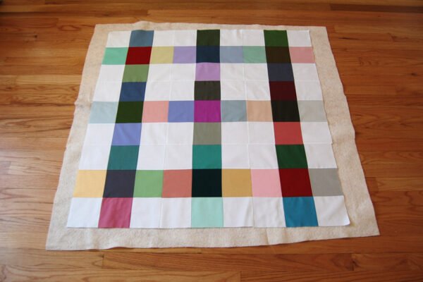 Minki Backed Patchwork Baby Quilt tutorial at WeAllSew