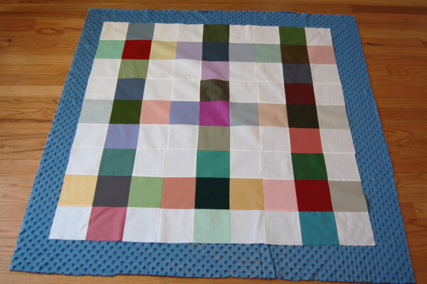 Minki Backed Patchwork Baby Quilt tutorial at WeAllSew