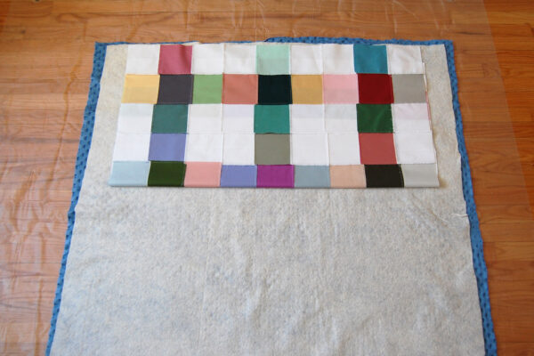 Minki Backed Patchwork Baby Quilt tutorial at WeAllSew