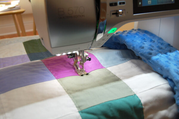 Minki Backed Patchwork Baby Quilt tutorial at WeAllSew