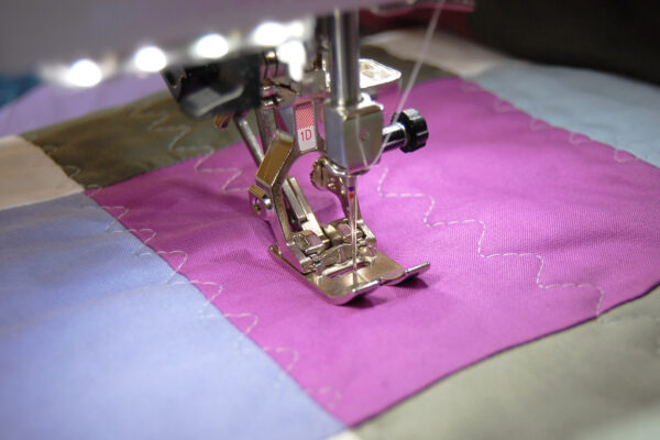 Minki Backed Patchwork Baby Quilt tutorial at WeAllSew