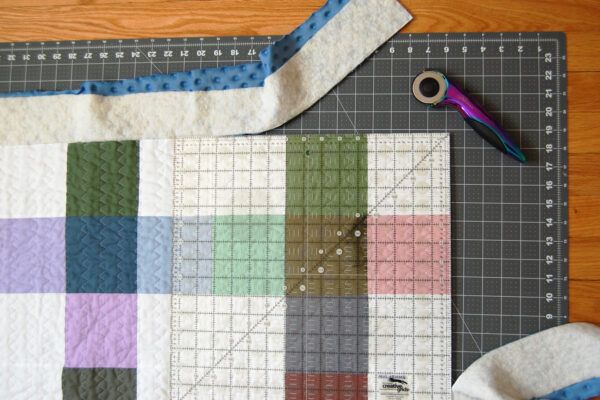 Minki Backed Patchwork Baby Quilt tutorial at WeAllSew