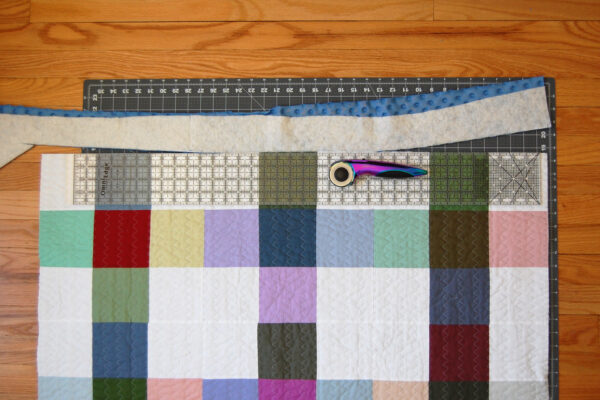 Minki Backed Patchwork Baby Quilt tutorial at WeAllSew