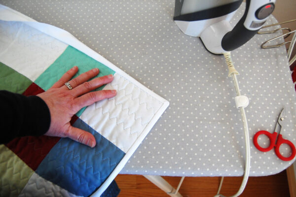 Minki Backed Patchwork Baby Quilt tutorial at WeAllSew