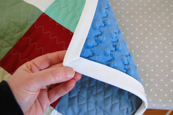 Minki Backed Patchwork Baby Quilt tutorial at WeAllSew