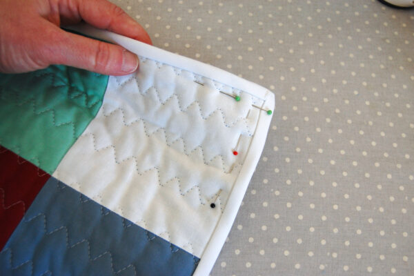Minki Backed Patchwork Baby Quilt tutorial at WeAllSew