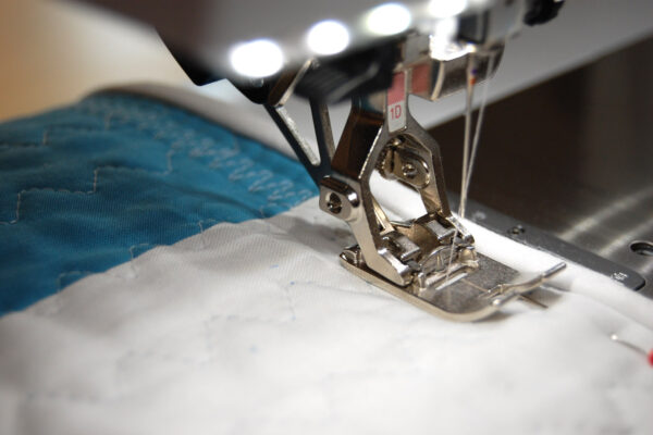 Minki Backed Patchwork Baby Quilt tutorial at WeAllSew