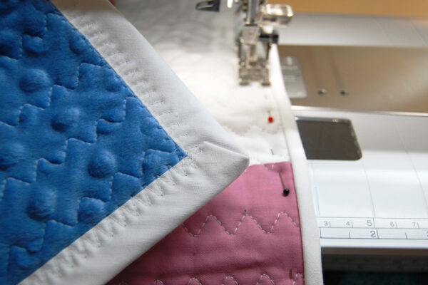 Minki Backed Patchwork Baby Quilt tutorial at WeAllSew