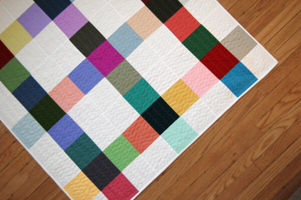 Minki Backed Patchwork Baby Quilt tutorial at WeAllSew