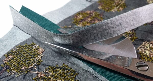 Trimming seam allowance on the quilt top
