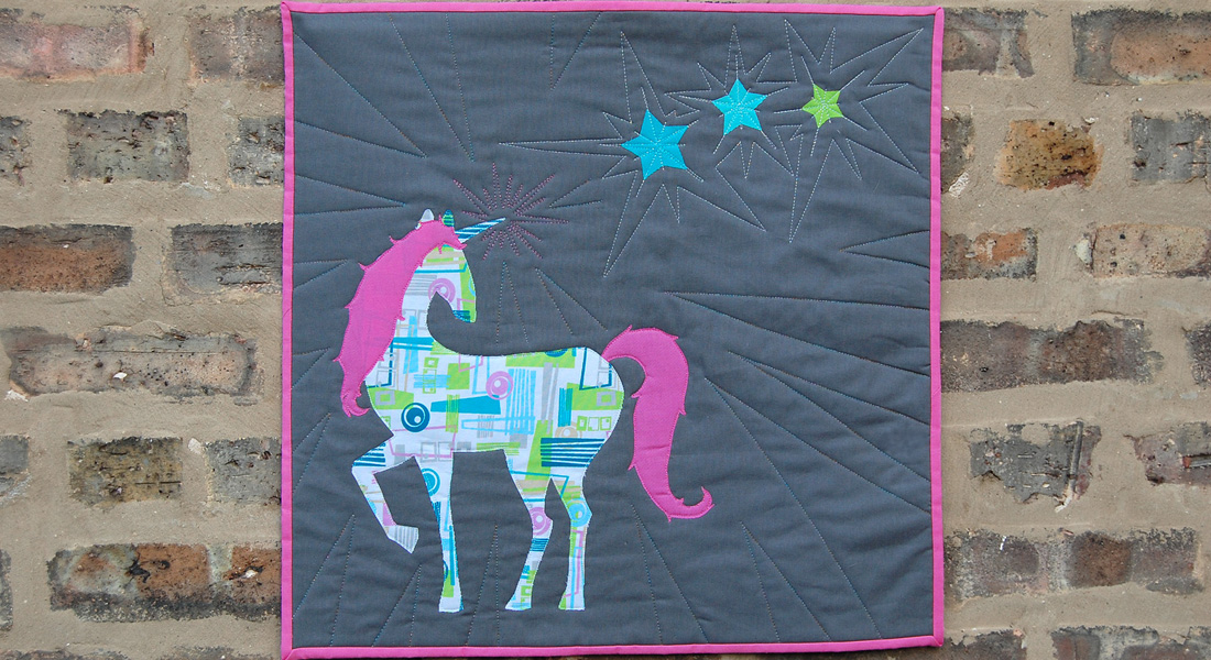 When you are happy with the quilting, square up your mini quilt with a ruler and rotary cutter.